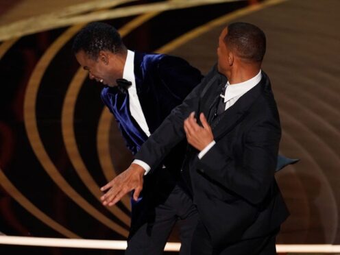 Will Smith hits presenter Chris Rock on stage at the Oscars (Chris Pizzello/AP)