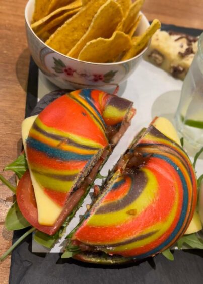 A rainbow bagel with the 'cheesy one' filling at Cup.