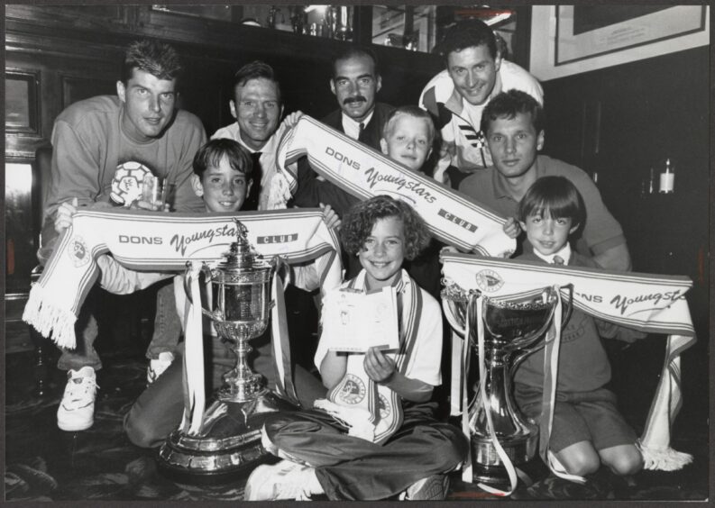 Theo Snelders, Jon McLeish, 9, and his famous dad Alex, Willie Miller, Calum Bett, 8, with dad Jim, Hans Gillhaus and Willie's son Mark Miller (6).