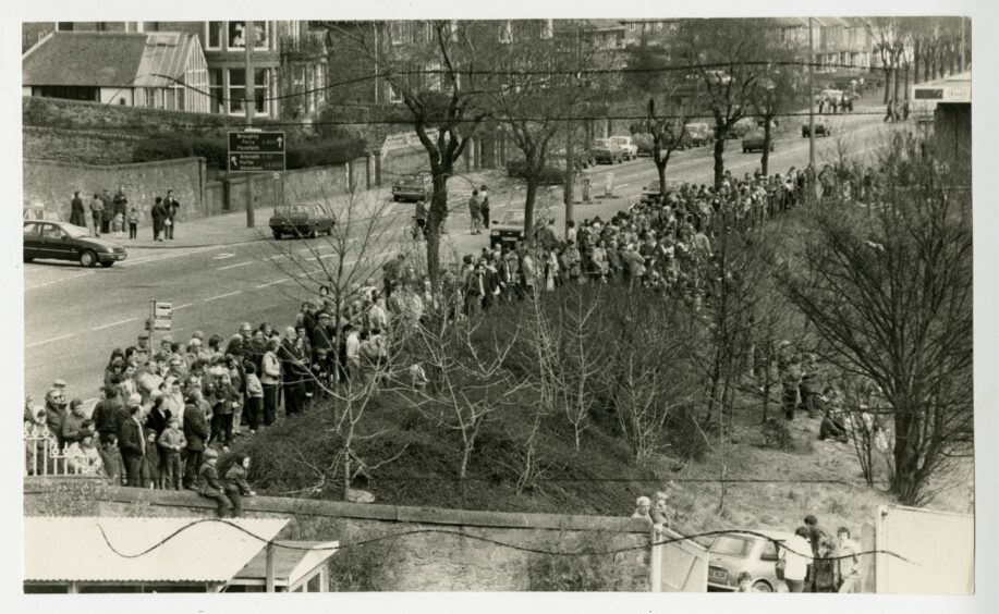 A large crowd turns out to watch the demolition in April 1984.