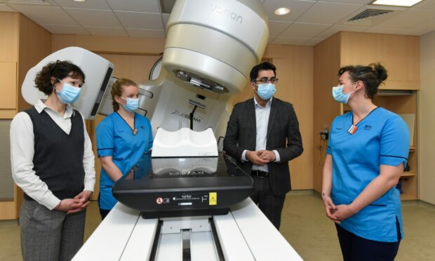 Humza Yousaf meets radiotherapy manager Nicola Redgwell, Rachel Ada and Megan Fraser-Bell at the Truebeam unit 3 within Aberdeen Royal Infirmary.