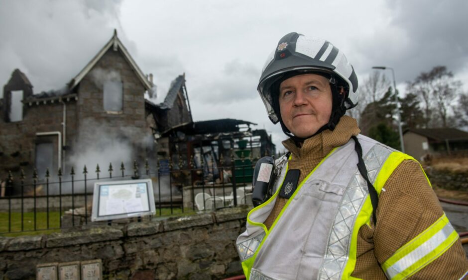 Fire group commander Ewan Baird at the scene of the fire at Braemar Lodge Hotel.