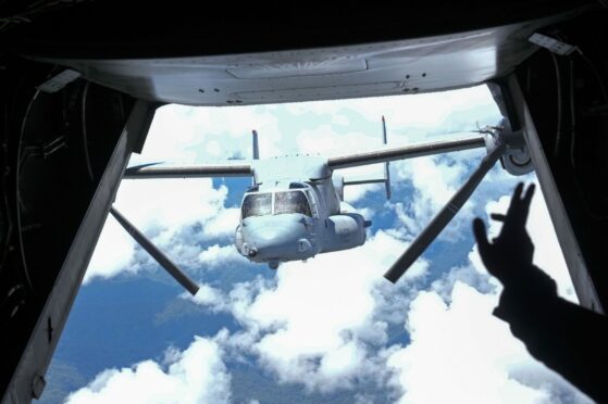 A US Marines OV-22 Osprey flies in tandem as they transport troops and journalists during an annual US-Philippines joint military exercise titled Balikatan, Tagalog - for "shoulder-to-shoulder" - on the beaches of Claveria, Cagayan province, northern Philippines. AP Photo/Aaron Favila.
