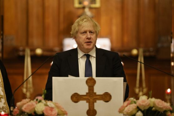 British Prime Minister Boris Johnson speaks during a visit to the Ukrainian Catholic Eparchy of Holy Family of London