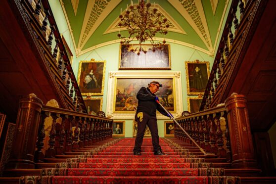 Conservation cleaner Tracie Mason works in the Grand Staircase at Longleat House in Wiltshire, ensuring it is ready to start welcoming visitors again on April 1 after a two-year absence. The home of the Marquess and Marchioness of Bath, the Wiltshire country house was shut due to the pandemic. The epic spring clean has involved a painstaking inspection of all the stately home's public state rooms and the thousands of priceless and historic objects and artworks they contain. Ben Birchall/PA Wire.