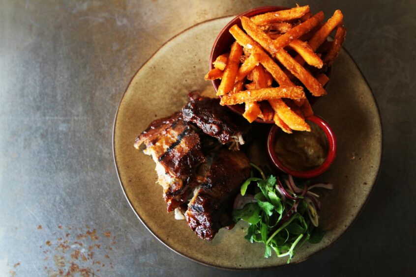 One of the dishes on offer: rack of ribs with spicy sauce and sweet potato fries.