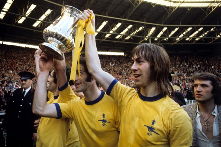 Frank McLintock, George Graham and Charlie George with the FA Cup in 1971.