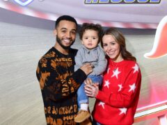 Aston Merrygold with his fiancee Sarah Richards and their eldest son Grayson (Ian West/PA)
