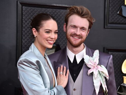 Claudia Sulewski, left, and Finneas arrive at the 64th Annual Grammy Awards at the MGM Grand Garden Arena (Photo by Jordan Strauss/Invision/AP)