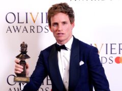 Eddie Redmayne after winning the Best Actor in a Musical award (Ian West/PA)