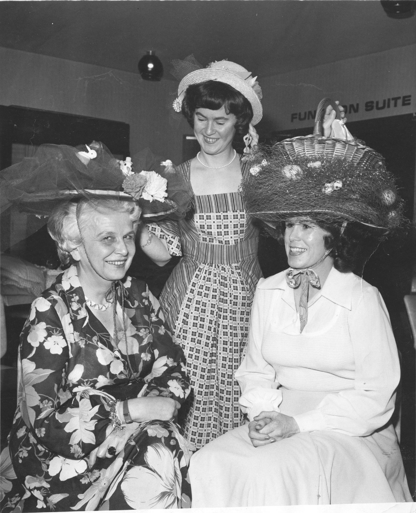 Three members of the Petroleum Women's Club of Scotland show off their Easter bonnet creations during their get-together at the Westhill Inn in 1978.