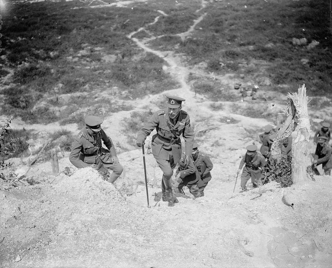 King George V climbing the Butte de Warlencourt in July 1917 during the First World War.