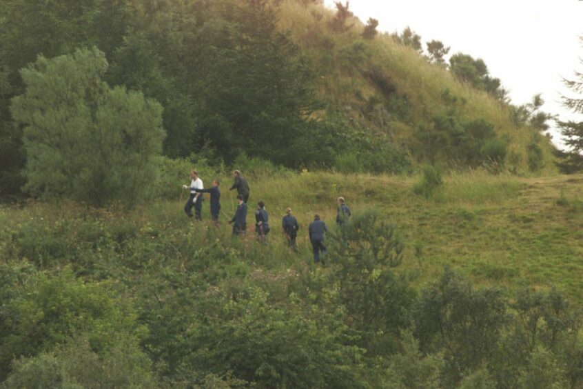 Police search the slopes of Dundee Law following the murder of Anne Nicoll.