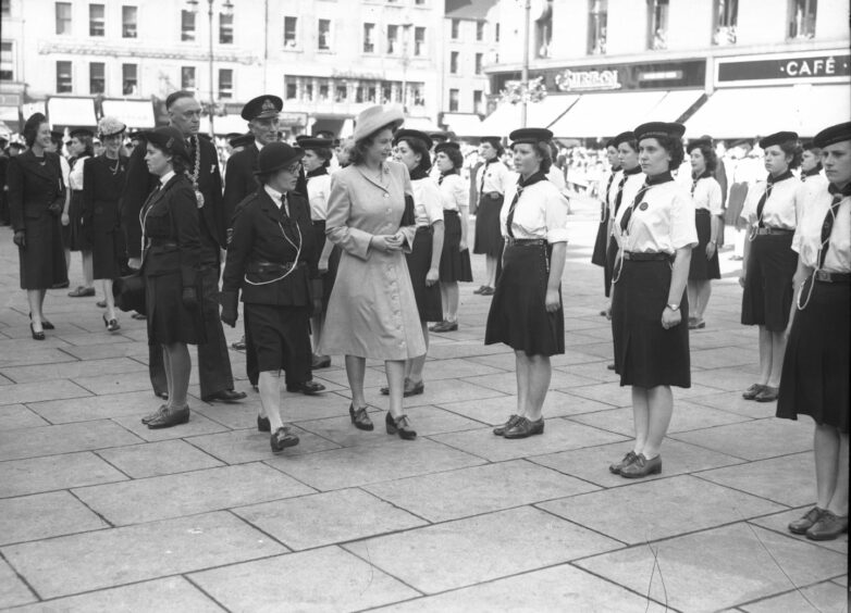 Princess Elizabeth inspects female sea rangers in Dundee City Square before the opening of Camperdown Park.