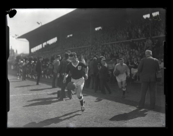 Skipper Bobby Cox and Liney run out against St Johnstone on that historic day back in April 1962.
