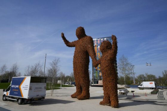 Two giant statues made out of metal bees greet visitors to the once-a-decade Dutch horticultural exhibition called Floriade, in Almere, Netherlands. The exhibition aims to showcase ways of making urban areas more sustainable as global populations increasingly shift to cities. AP Photo/Peter Dejong.