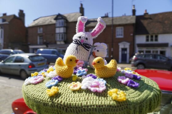 An Easter scene has been knitted on top of a post box in Midhurst, Sussex. Steve Parsons/PA Wire.