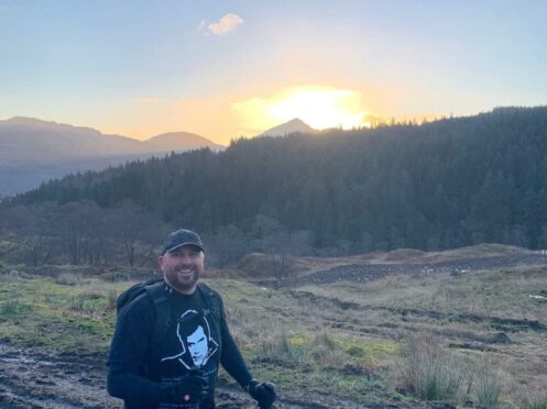 Raymond Smith pictured in the foreground with Ben Lomond in the background