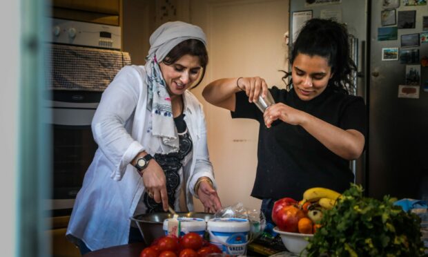 Fatima and Yusra Ramzan preparing food.