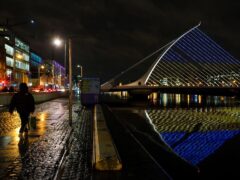 The Samuel Beckett Bridge in Dublin displays the colours of the Ukrainian flag (Brian Lawless/PA)
