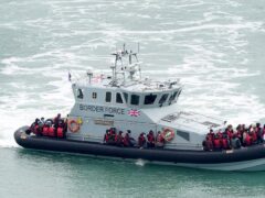 A group of people thought to be migrants are brought in to Dover, Kent, on board a Border Force vessel (Gareth Fuller/PA)