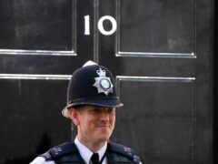 A Metropolitan Police officer stands outside 10 Downing Street (Dominic Lipinski/PA)