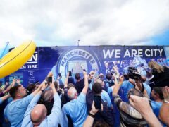 Manchester City fans celebrated on Sunday (PA)