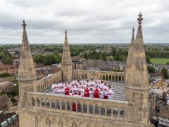 A choir sang from the rooftop of St Johns Chapel tower in Cambridge to mark Ascension Day, continuing a tradition that dates back to 1902 (PA)