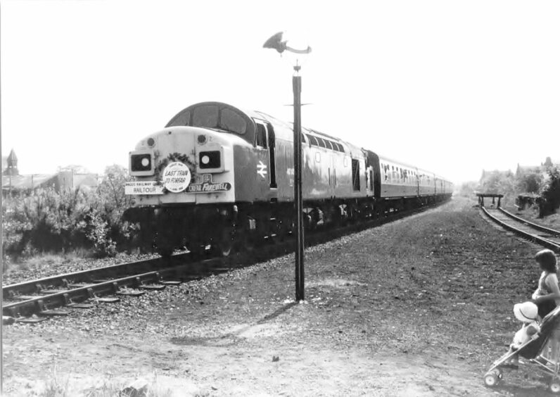John Cumming's photo shows the Forfar Farewell special train travelling through Coupar Angus in 1982.