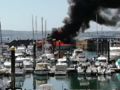 The yacht on fire in Torquay (Cat Johns/PA)