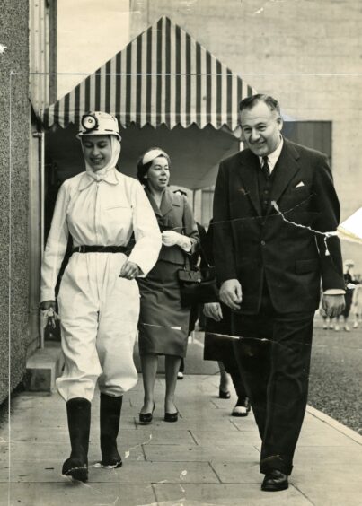 The Queen dressed in protective clothing at Rothes Colliery with Mr Ronald W Parker Chairman of Scottish Divisional Coal Board, 20 June 1958. 