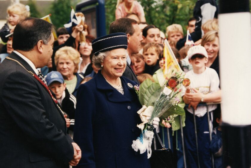 Her Majesty is accompanied by Fife Council convener John Macdougall as she arrives at the Kingdom Centre, Glenrothes.