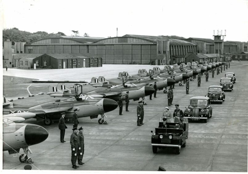 The Queen and Prince Philip review the Venoms at RAF Leuchars from the back of a jeep, 4 June 1957