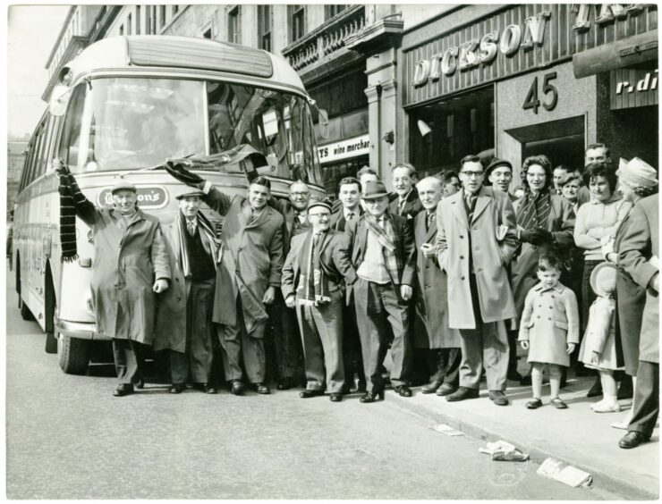 Dundee FC fans getting ready to head off on the bus for the trip to the San Siro in Milan in April 1963.