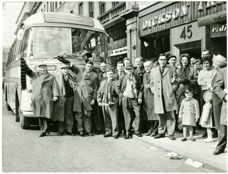 Dundee FC fans who made the bus trip to the San Siro, home of AC Milan, in April 1963. Image: DC Thomson.