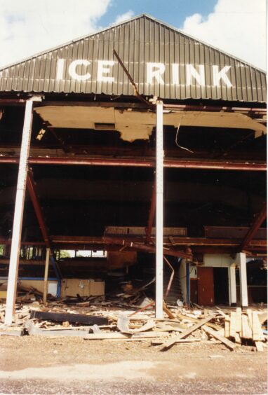 The partially demolished ice rink with the roof still visible in this image from 1990.