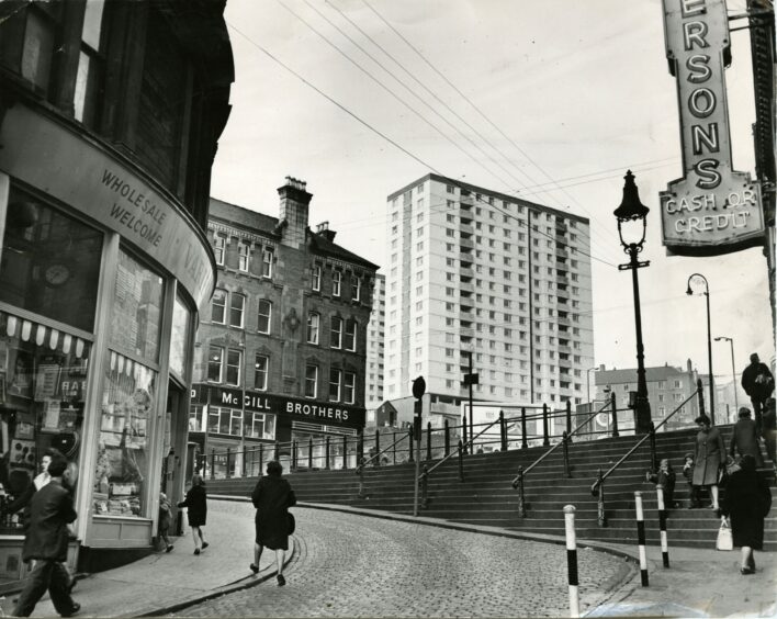 Towering above Wellgate Steps is one of the Dallfield multi-storey blocks in 1966. Image: DC Thomson.