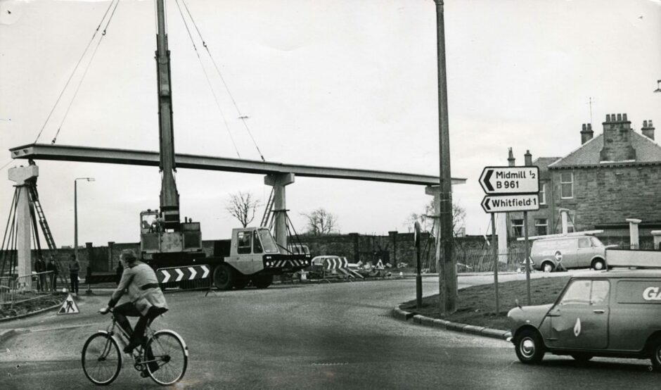 A pedestrian bridge is erected across Kingsway East from Pitkerro Road to Old Craigie Road in 1974.