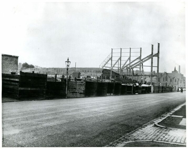 Looking in at Tannadice shows the high girders under erection for the new stand in 1961.