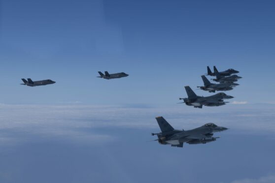 South Korea and the U.S. engage in an air power demonstration, involving F-35A radar-evading fighters, over the Yellow Sea. South Korea Joint Chiefs Of Staff/ZUMA Press Wire/Shutterstock.