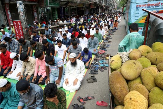 Muslims performing Friday prayers on the main road of Dhaka due to lack of space in the mosque