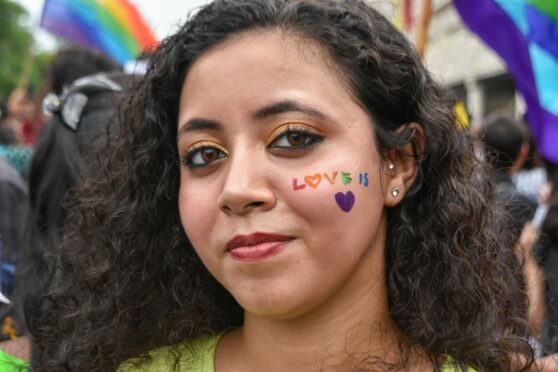 A participant poses for the camera during pride parade in Kolkata, India. Various social organisations held a pride rally in support of LGBTQ community, on the occasion of pride month in Kolkata. Debarchan Chatterjee/NurPhoto/Shutterstock.
