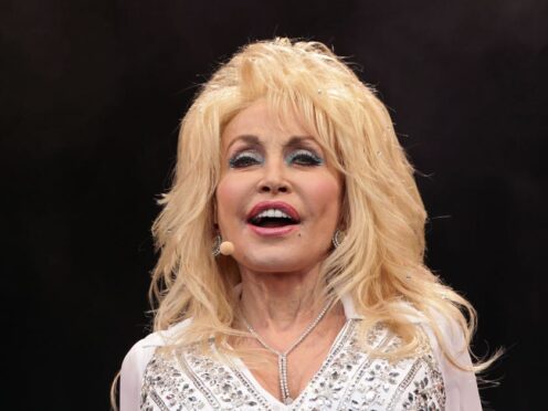 Dolly Parton’s novel is set to be made into a film by Reece Witherspoon’s production company (Yui Mok/PA)