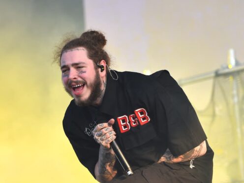 Post Malone is engaged and has welcomed his first child (Matt Crossick/PA)