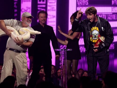 Jackass star Poopies was joined onstage by an enormous white anaconda after he accepted the MTV Movie and TV Award for best kiss (Chris Pizzello/AP)