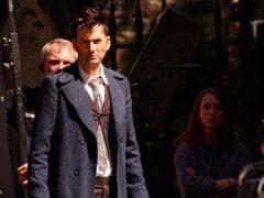 David Tennant has been spotted on the set of Doctor Who donning his classic suit and trenchcoat as filming for the hit sci-fi series takes place in Bristol (Ben Birchall/PA)