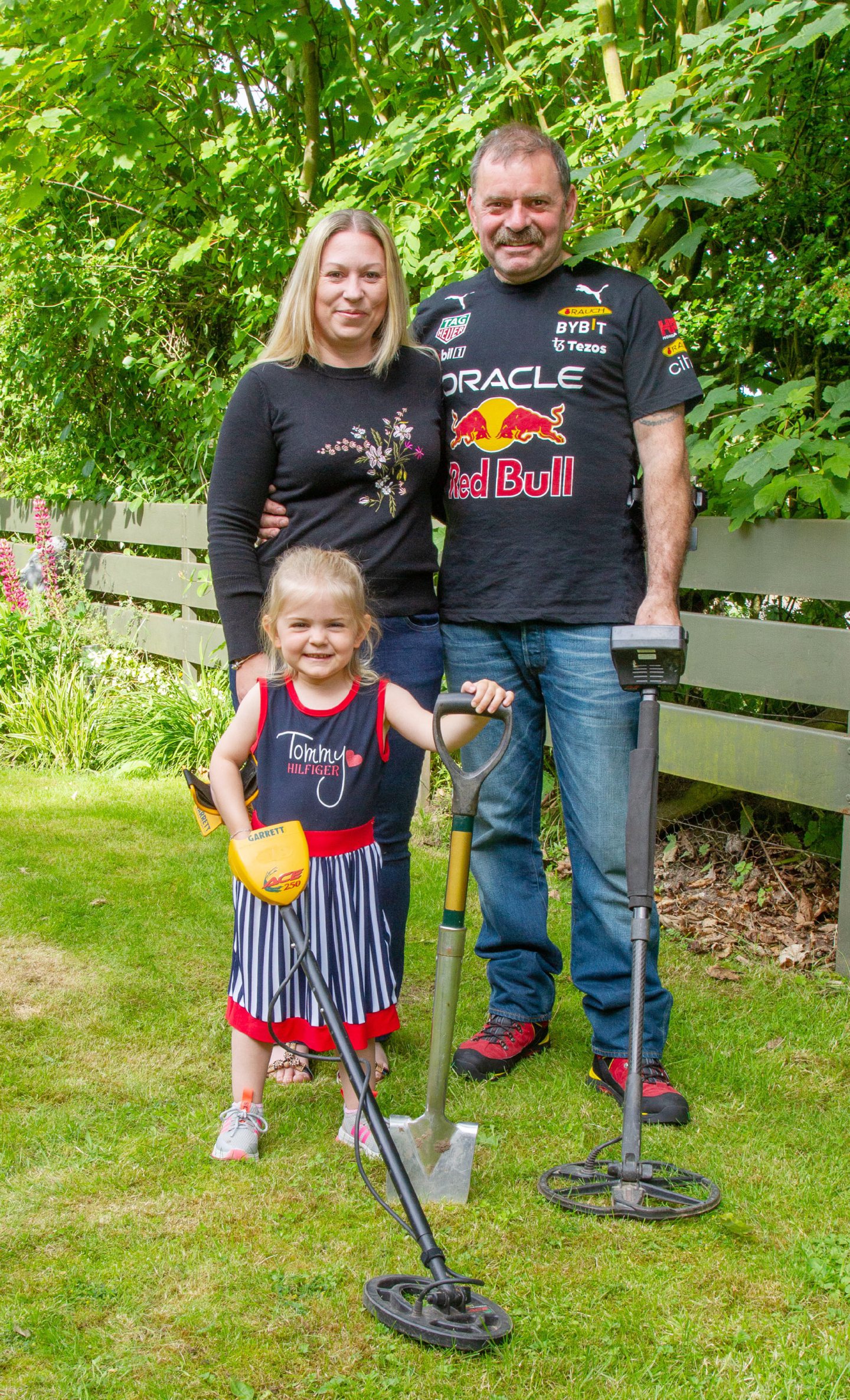 Carl Williams and Lorna Williams with Harley-Rose Williams and their metal detecting equipment.