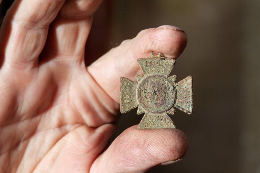 The historic medal which was discovered by the young treasure hunter.