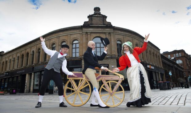 The interactive street theatre outfit Future Follies with a prop bicycle