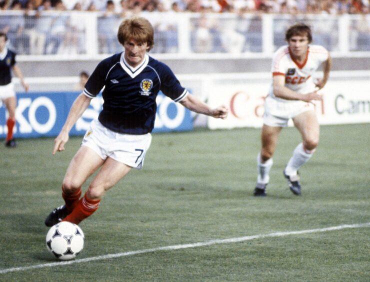 Gordon Strachan is pursued by a Soviet Union defender in Scotland's final game.